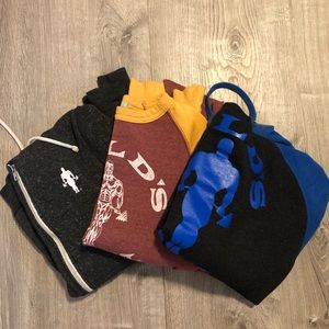 Set of three golds gym sweatshirts.